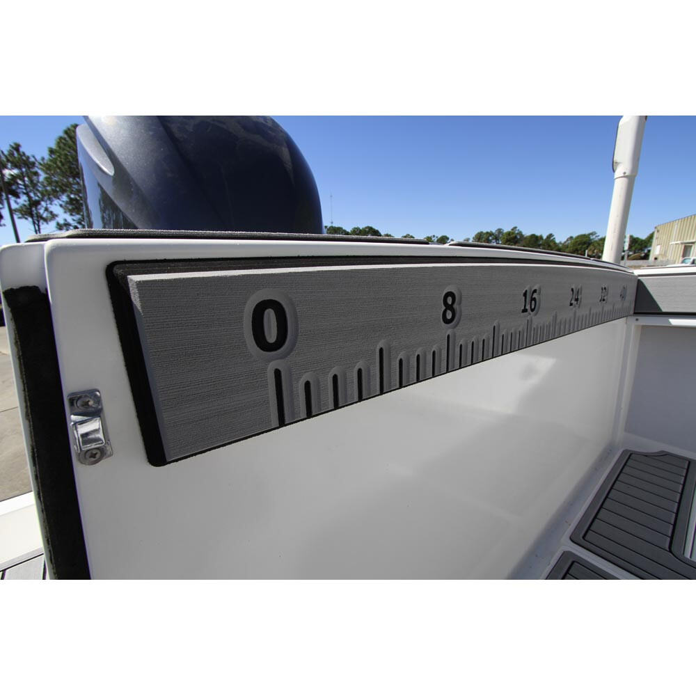 A SeaDek fish ruler with fade-resistance after installation, stuck to the side of a boat