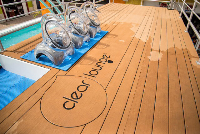 SeaDek custom pool deck surface showing wet textured foam panels and inlaid logo on a non-slippery pool deck