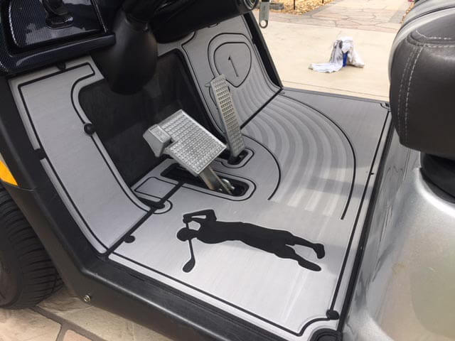 personalized SeaDek golf cart mats installed in a golf cart