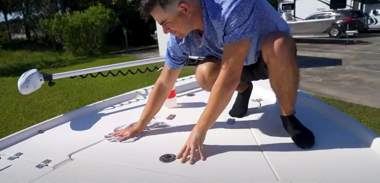 degreasing a boat's surface ready for SeaDek installation
