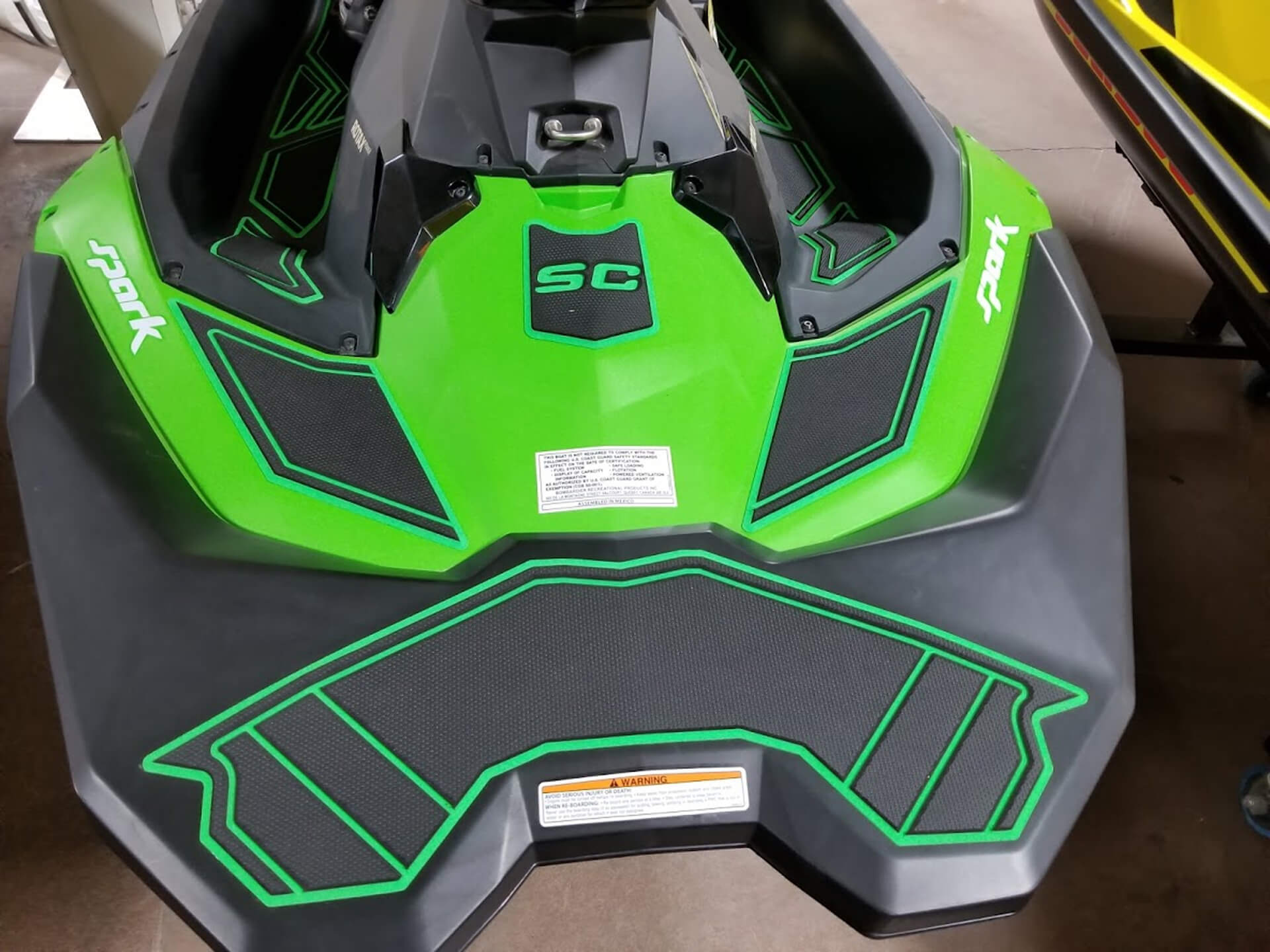 green SeaDek jet ski traction mats installed on a SeaDoo vessel