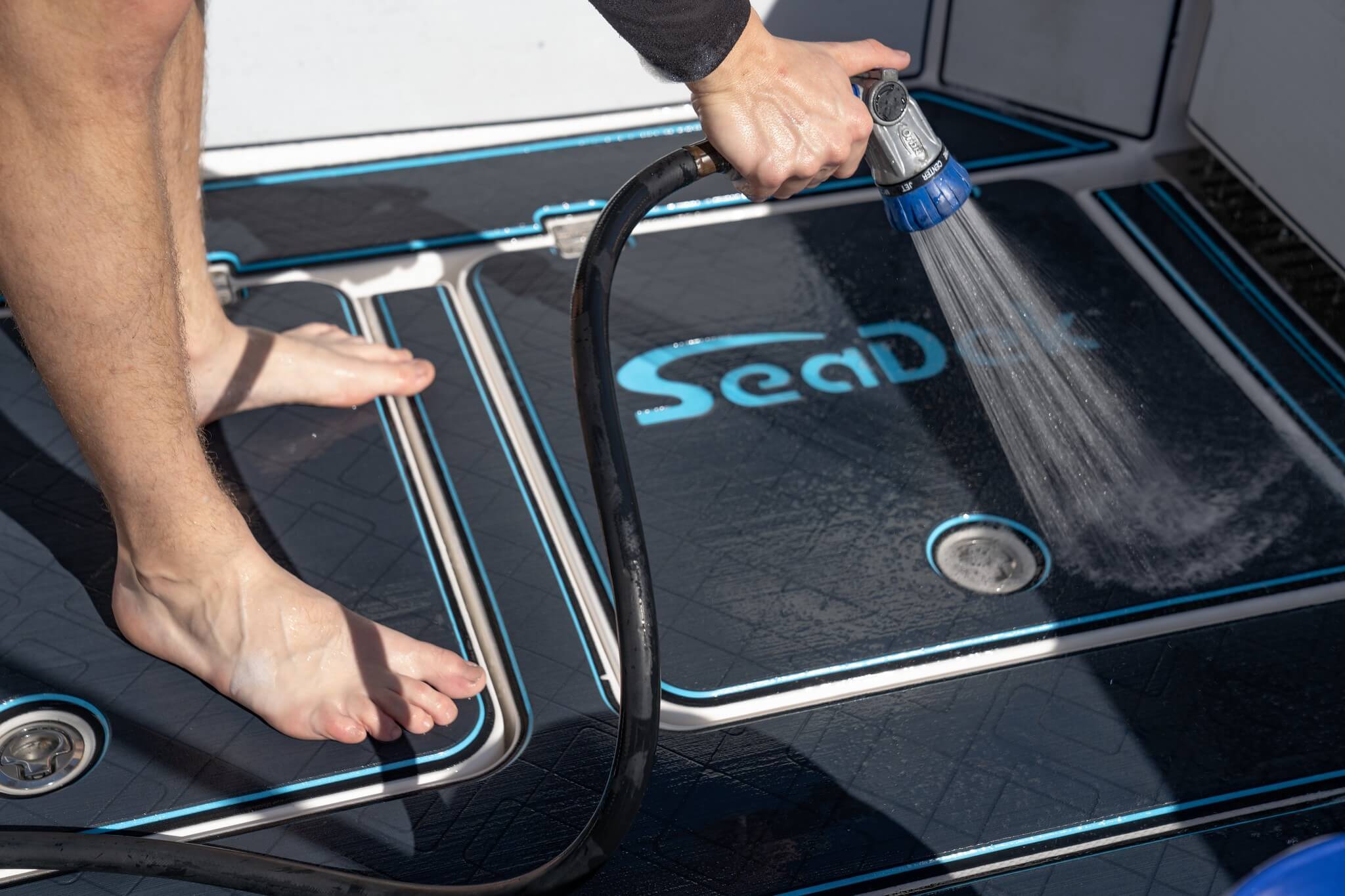 person taking care of their boat flooring